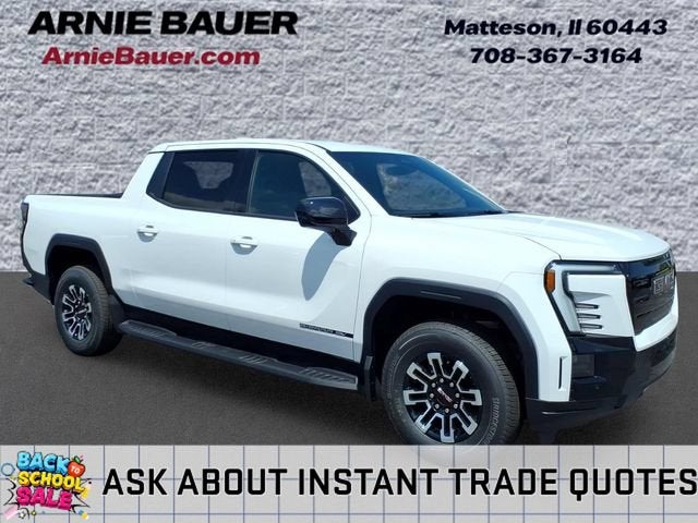 2026 GMC Sierra EV Elevation Standard Range in Summit White — front three-quarter view