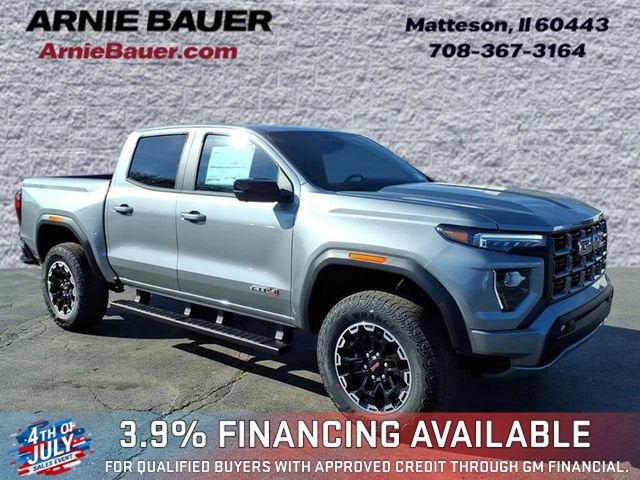 2026 GMC Canyon AT4 in Sterling Metallic — front three-quarter view