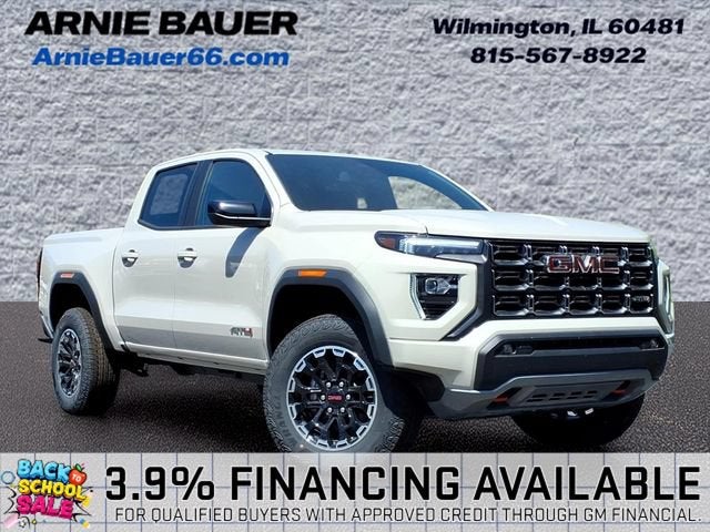 2026 GMC Canyon AT4 in Coastal Dune — front three-quarter view